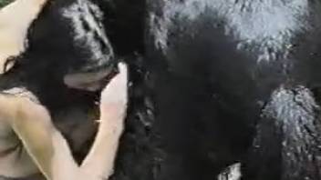 Dark-haired zoophile enjoys filthy romps with a stallion