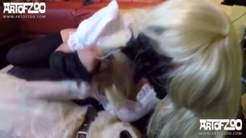 Blonde wearing a mask has her pierced vagina tenderly licked by her pet dog