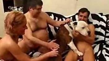 Two men are fucking with a doggy in 3some mode