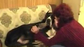 Redhead zoophile slut gives her doggy a blowjob
