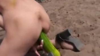 Nude amateur slut shoves a giant cucumber up the ass in outdoor XXX