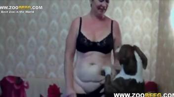 Rough fuck video in which a MILF gets gaped by a dog