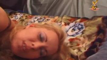 A sun-kissed blonde in alluring black stockings has sex with a dog