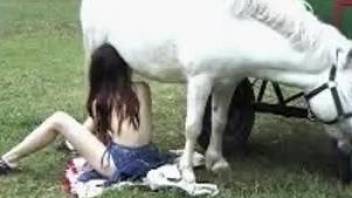 Redhead bitch gives this white pony a nice oral treat