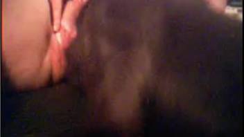 Filthy amateur bestiality involving a black dog