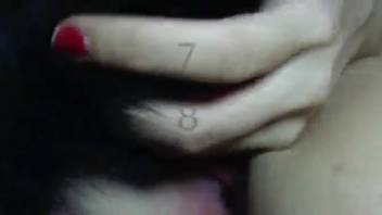 Horny woman stimulates her vagina with the canine's penis