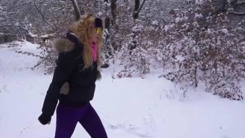 Horny blonde lady fucks a sexy dog in the snow