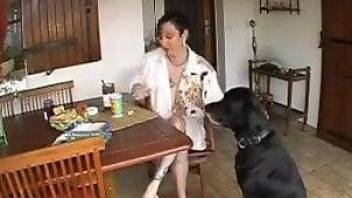 Aroused mature gets intimate with her dog during a live solo