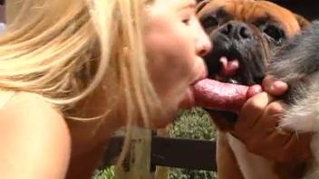 Petite blond babe experiments with massive canine dick in her tight small vagina