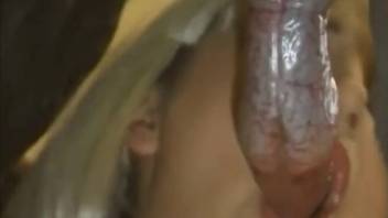 Blonde whore deepthroats the moist canine cock in imaginary XXX fantasy